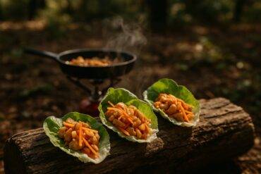 Cooked Asian-style chicken mixture served in crisp lettuce leaves ready to assemble as wraps.